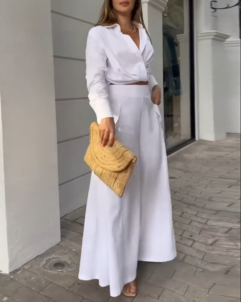 A ruched crop top paired with wide-leg pants in a matching LA FINE FLEUR  two-piece set.