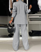 A notched collar blazer and wide-leg pants set with white stripes, loose fit.