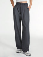 Charcoal gray LA FINE FLEUR Airstream tailored straight-leg dress pants with white sneakers.