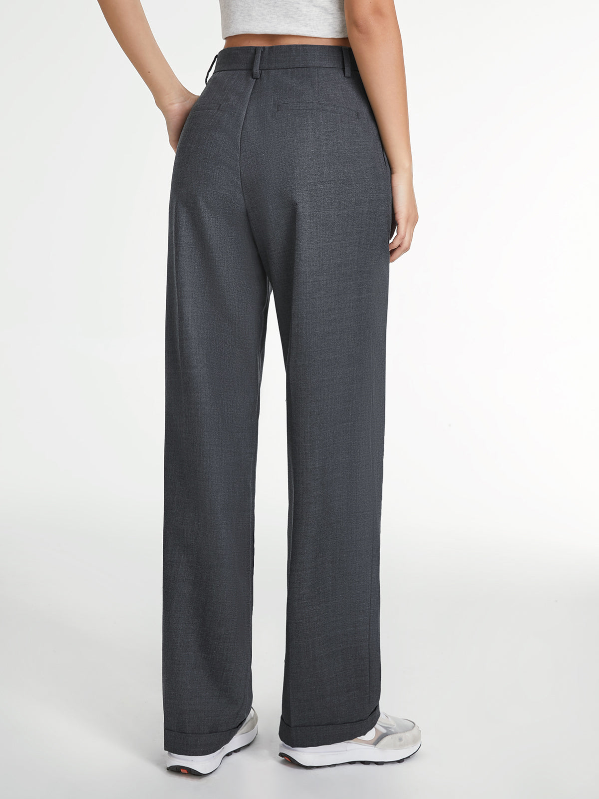 LA FINE FLEUR Airstream Tailored Straight-Leg Dress Pants in gray with white sneakers.