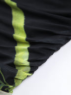 Black mesh midi dress with yellow-green stripe, ruffled detailing, sheer pleated tube style.