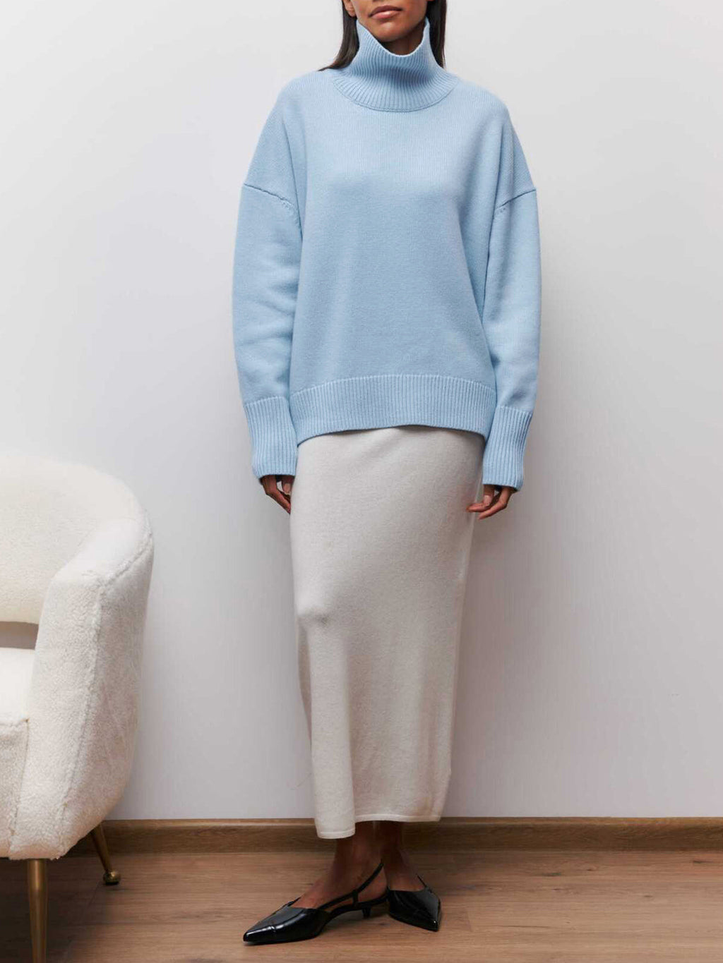 BYPINKYPARIS Clear Sky Turtleneck Oversized Sweater paired with a flowing cream maxi skirt.