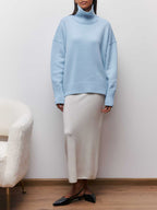 BYPINKYPARIS Clear Sky Turtleneck Oversized Sweater paired with a flowing cream maxi skirt.