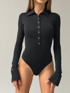 A fitted collared button-down bodysuit with long sleeves, flared cuffs, and button-up front.