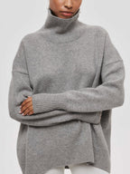 Light gray BYPINKYPARIS Clear Sky Turtleneck Oversized Sweater with long sleeves.