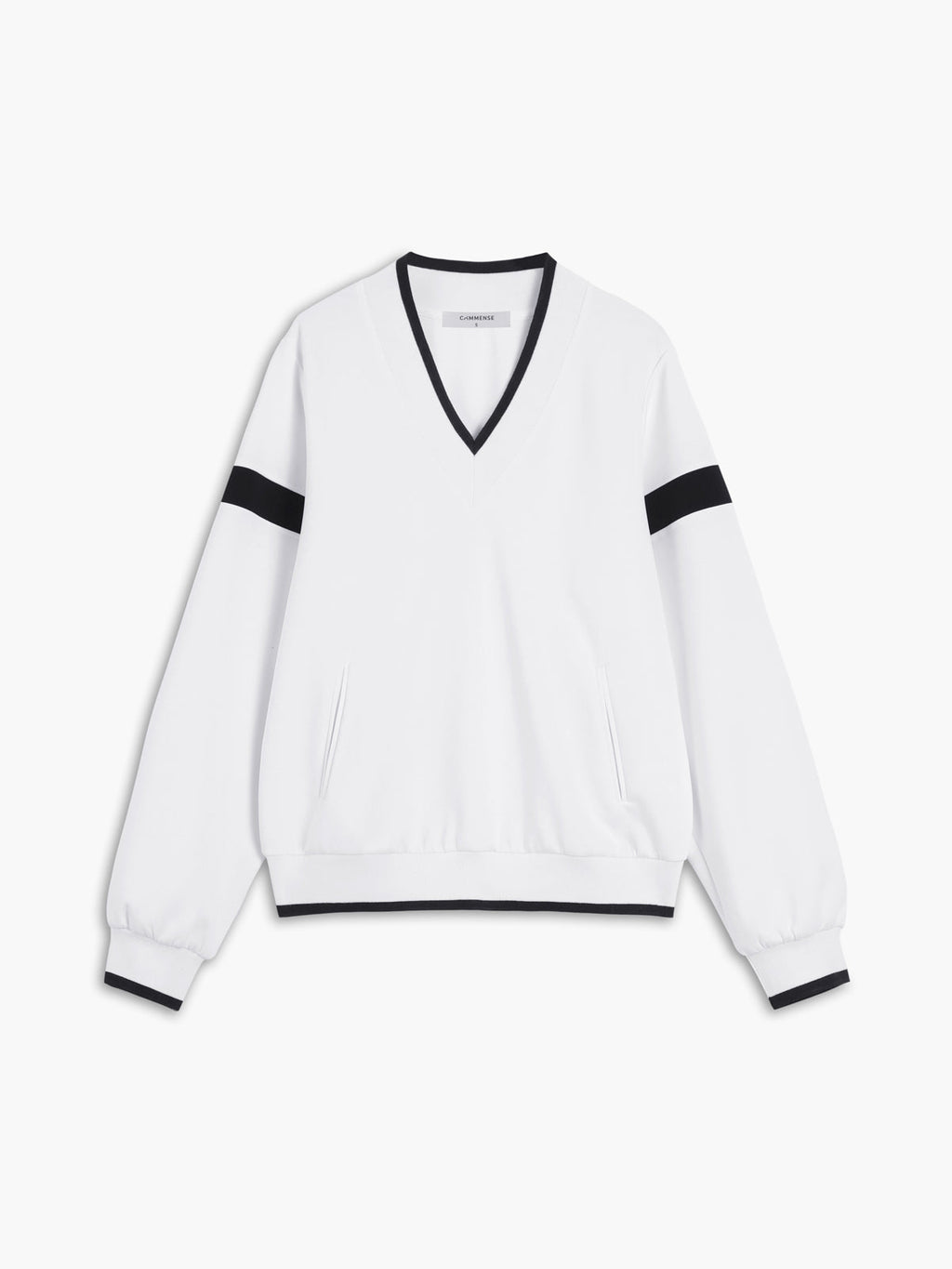 A white oversized sweatshirt with black trim on the collar, cuffs, waistband, and sleeves.