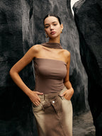A Seamless Halter Neck Jersey Tube Top paired with two-tone pants.