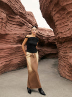 Unique one-shoulder top with elegant side knot, paired with a brown ombré maxi skirt.
