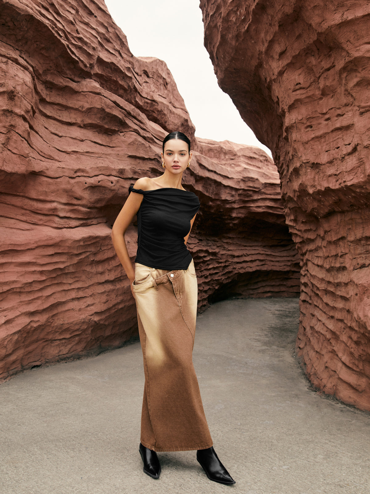 Unique one-shoulder top with elegant side knot, paired with a brown ombré maxi skirt.