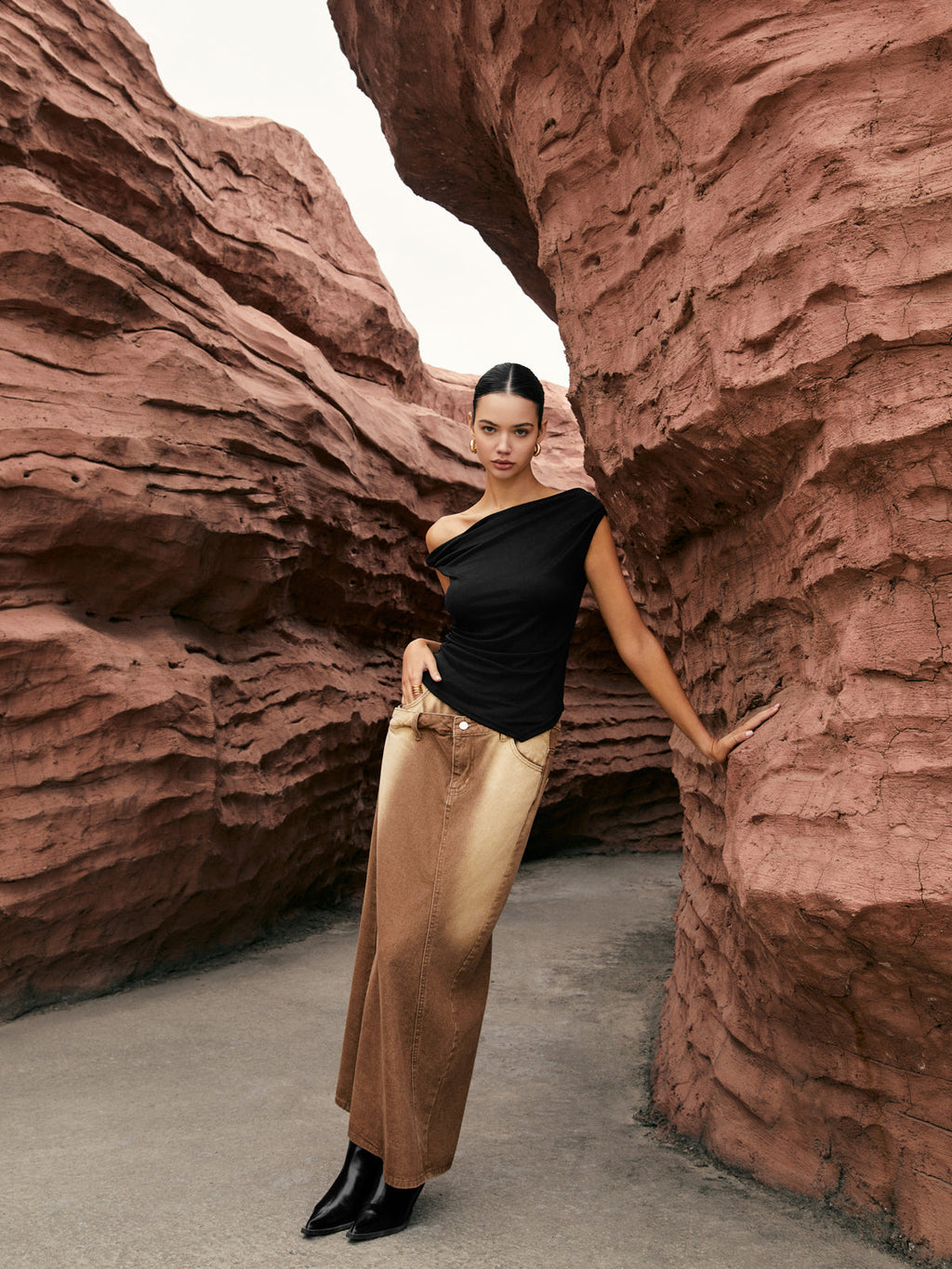 Unique one-shoulder top with elegant side knot and gold metallic maxi skirt.