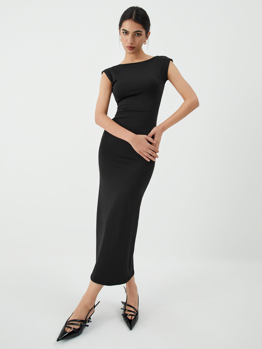 A sleek open-back midi dress in a sophisticated style, perfect for evening events.