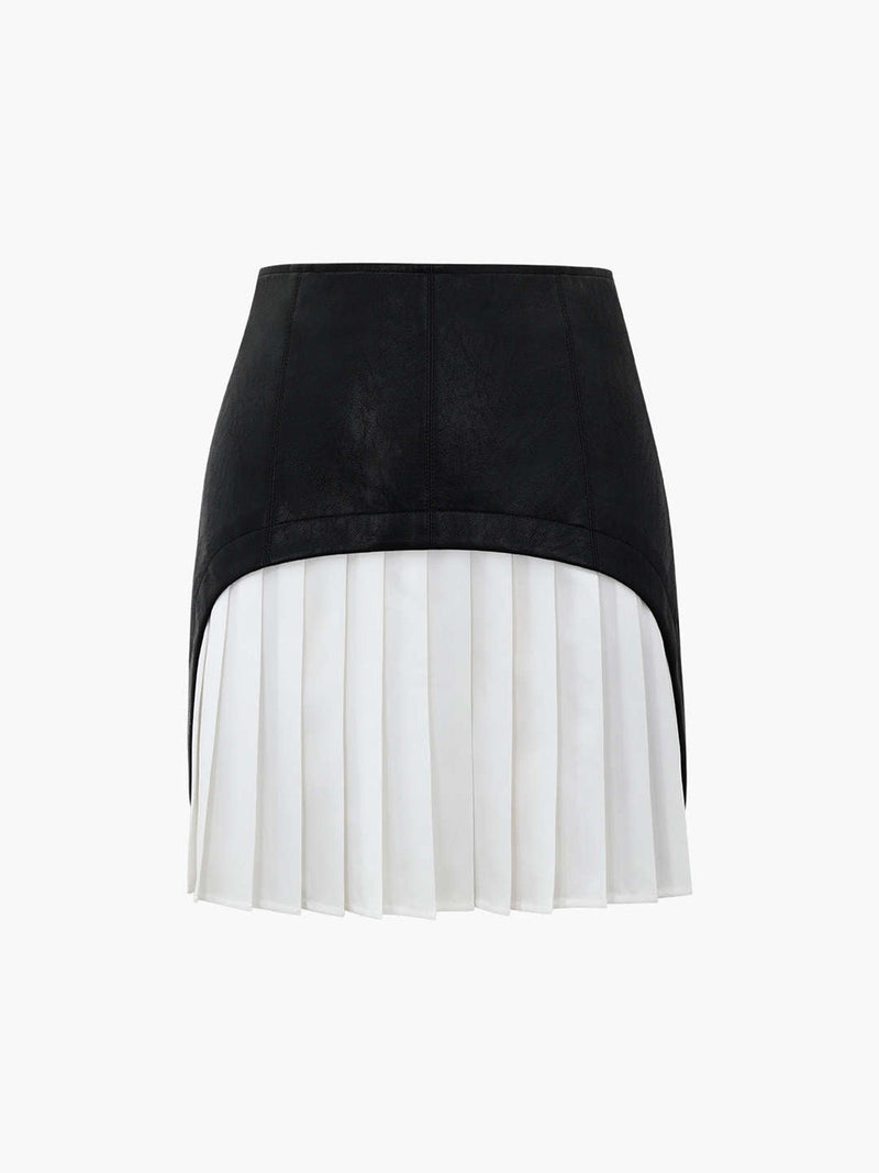 A black faux leather patchwork mini skirt with a high-low hem and white pleated insert.