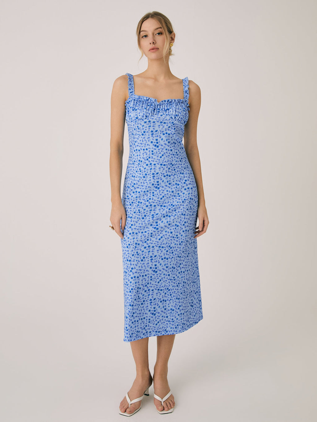 A LA FINE FLEUR Cami Floral Bohemian Midi Dress designed for vacation, featuring a floral pattern.