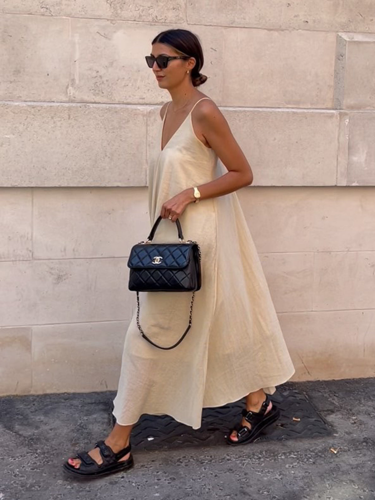 A dual-layer V-neck long dress in a flowing silhouette, designed by LA FINE FLEUR.