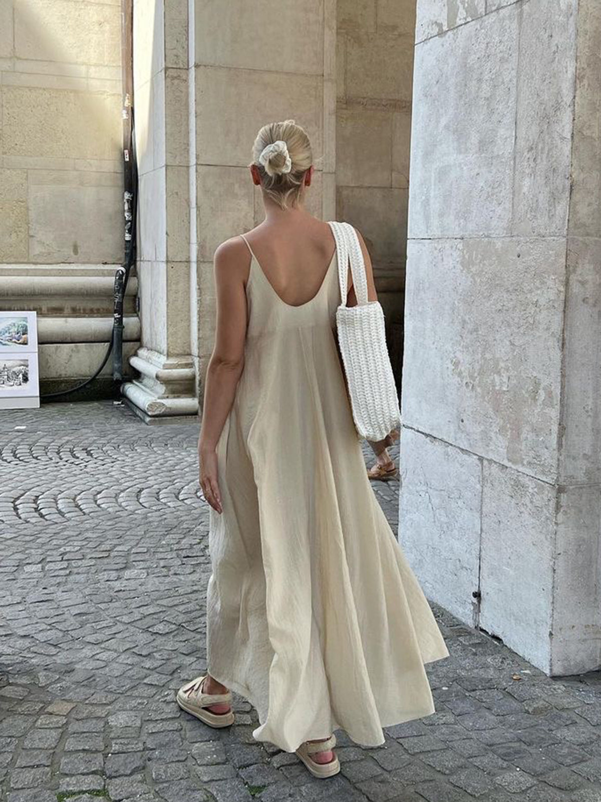 LA FINE FLEUR Dual Layer V-Neck Long Dress in a flowing, elegant cream fabric.