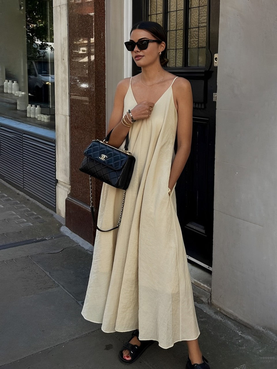 A dual layer V-neck long dress from LA FINE FLEUR in a sleek, minimalist design.