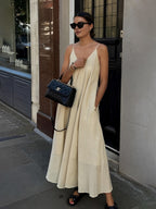 A dual layer V-neck long dress from LA FINE FLEUR in a sleek, minimalist design.