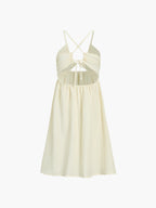 Light yellow midi dress with ruched bodice, gathered skirt, crisscross back, and front cutout.
