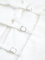Backless halter neck camisole top with thin straps, square silver buckles, smooth fabric.