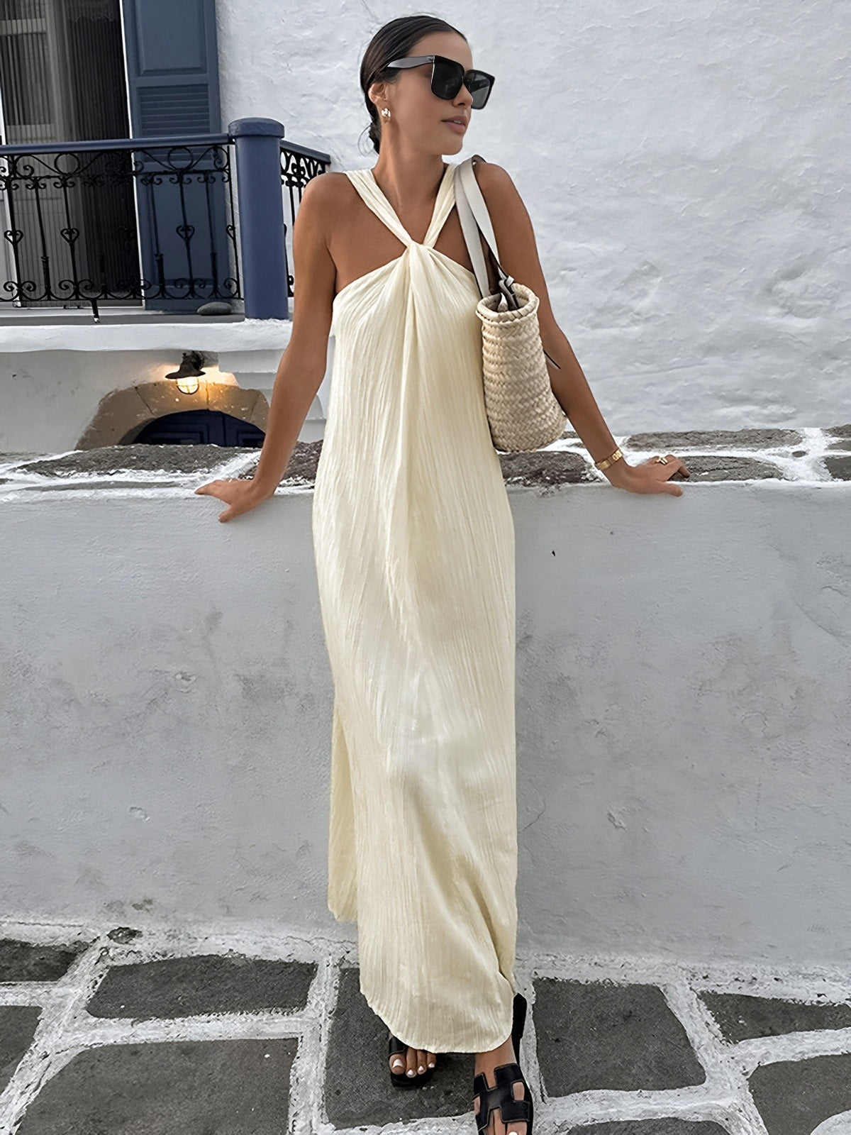 A creamy long halter gown from LA FINE FLEUR, elegant and flowing in style.