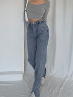 Gray long-sleeve crop top, white sneakers, and LA FINE FLEUR straight leg denim jeans.