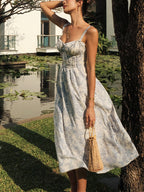 The LA FINE FLEUR Sapphire Blossom Print Camisole Midi Dress with delicate floral patterns.