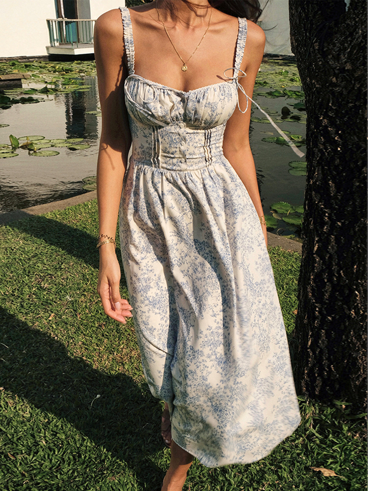 LA FINE FLEUR Sapphire Blossom Print Camisole Midi Dress featuring a vibrant blue floral pattern.