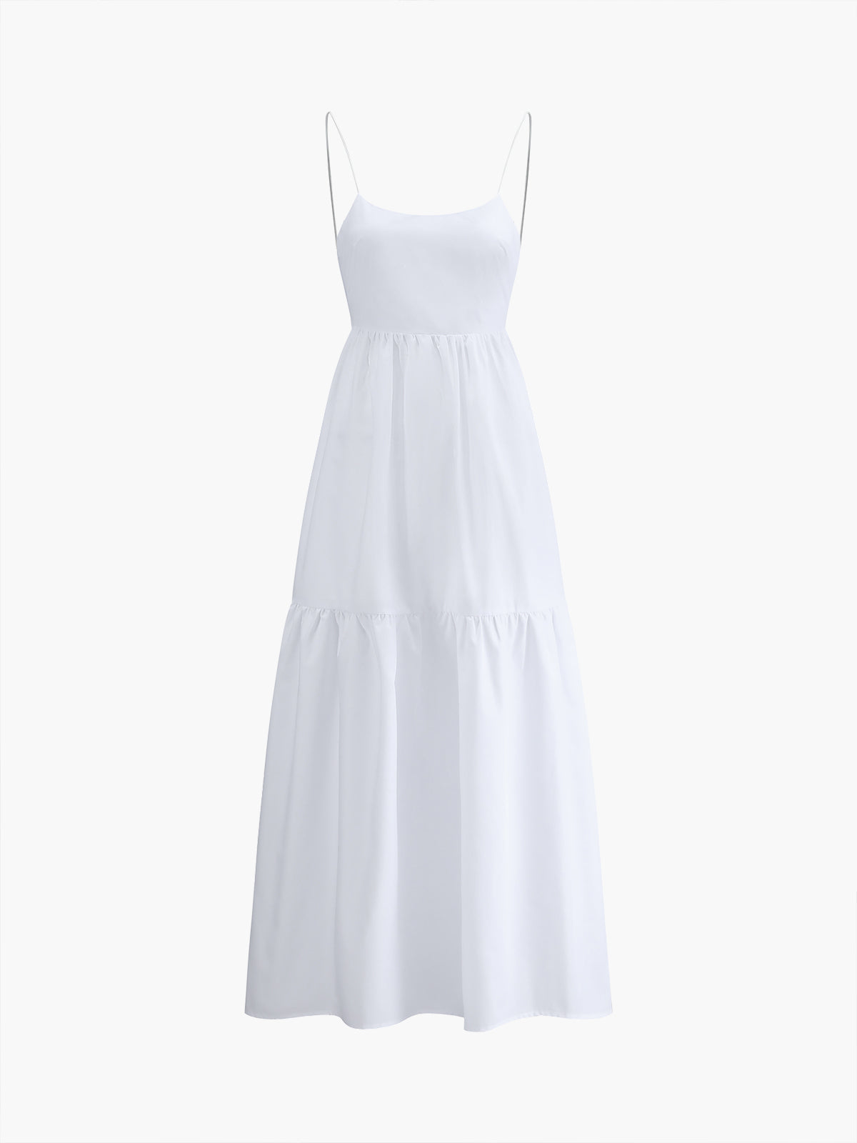 A white maxi dress with thin spaghetti straps, open back, and tiered flowing skirt.
