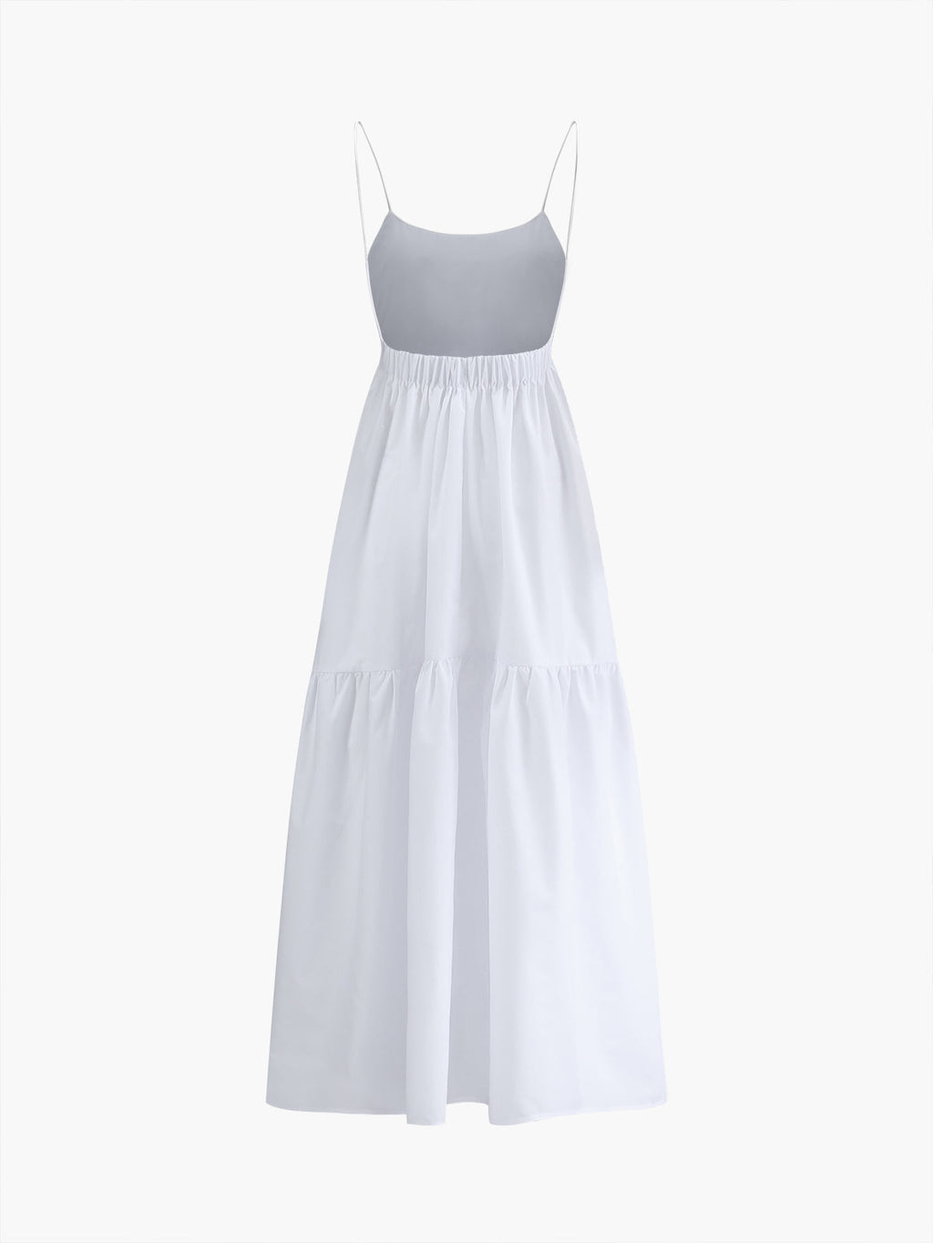 White maxi dress with thin spaghetti straps, gathered waist, open back, and tiered skirt.