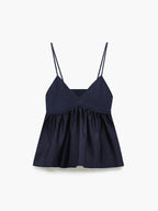 Navy blue satin camisole crop top with spaghetti straps, ribbed v-neck bodice, flared hem.