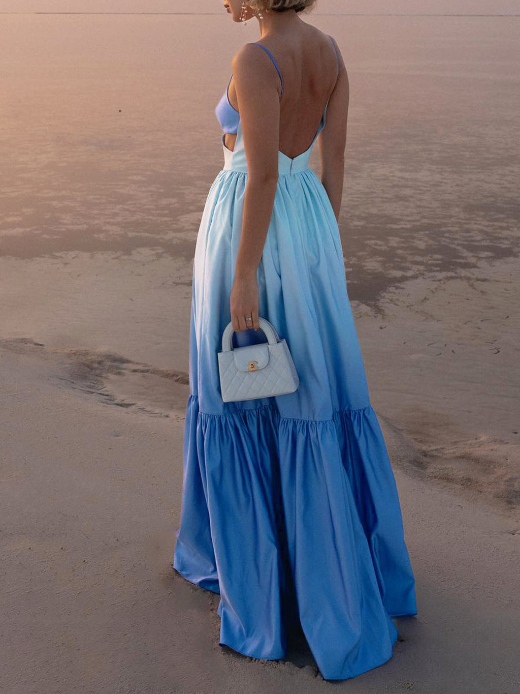 LA FINE FLEUR Backless Long Dress with cami top and side cutout details.