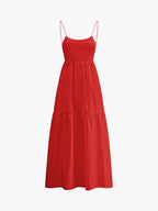 Bright red sleeveless long dress with spaghetti straps, fitted bodice, and flowy tiered skirt.