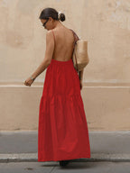 Elegant sleeveless long red dress with open back from LA FINE FLEUR.