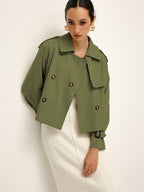 LA FINE FLEUR double-breasted lapel trench coat with tailored fit over a white ribbed skirt.