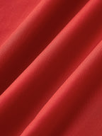 Elegant sleeveless long red dress with silky folds and open back, soft sheen fabric.