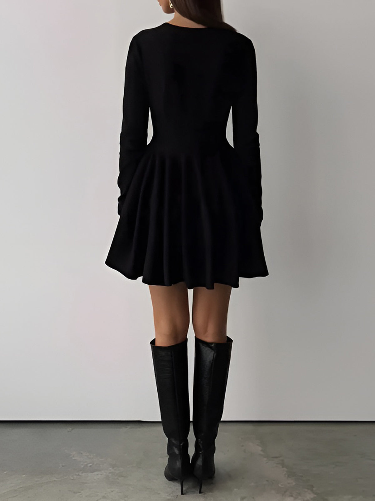 LA FINE FLEUR's Simple Pleated Sweater Dress with a short hem and knee-high black boots.