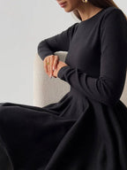 A Simple Pleated Sweater Dress with Short Hem in a flattering fit-and-flare design.