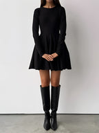 Simple Pleated Sweater Dress with short hem, long sleeves, flared skirt, black knee-high boots.