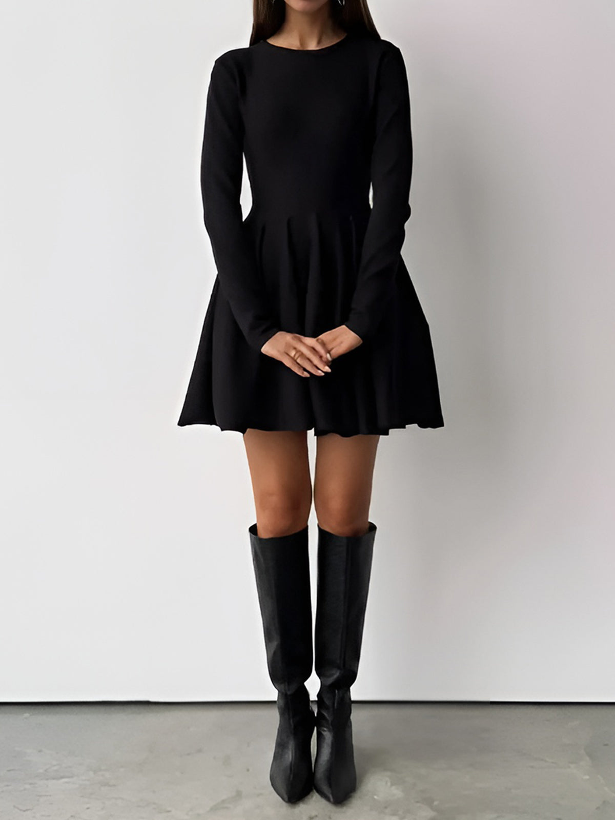 Simple Pleated Sweater Dress with short hem, long sleeves, flared skirt, black knee-high boots.