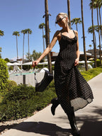 LA FINE FLEUR Sheer Chiffon Polka Dot Backless Long Dress with delicate, flowy silhouette.