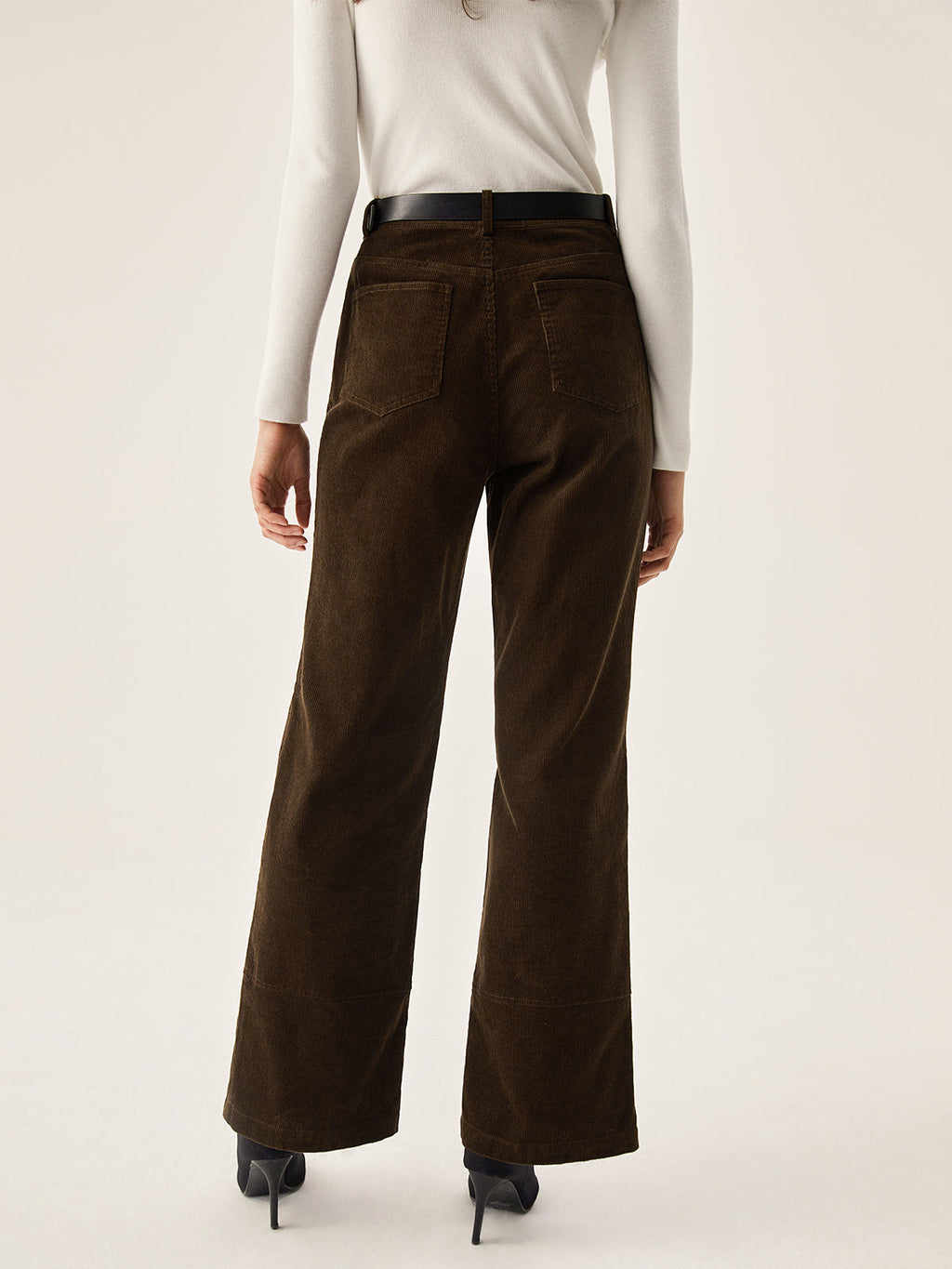 Dark brown LA FINE FLEUR corduroy wide leg pants with pockets, white long-sleeve top, black heels.