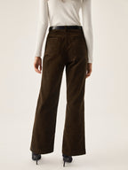 Dark brown LA FINE FLEUR corduroy wide leg pants with pockets, white long-sleeve top, black heels.