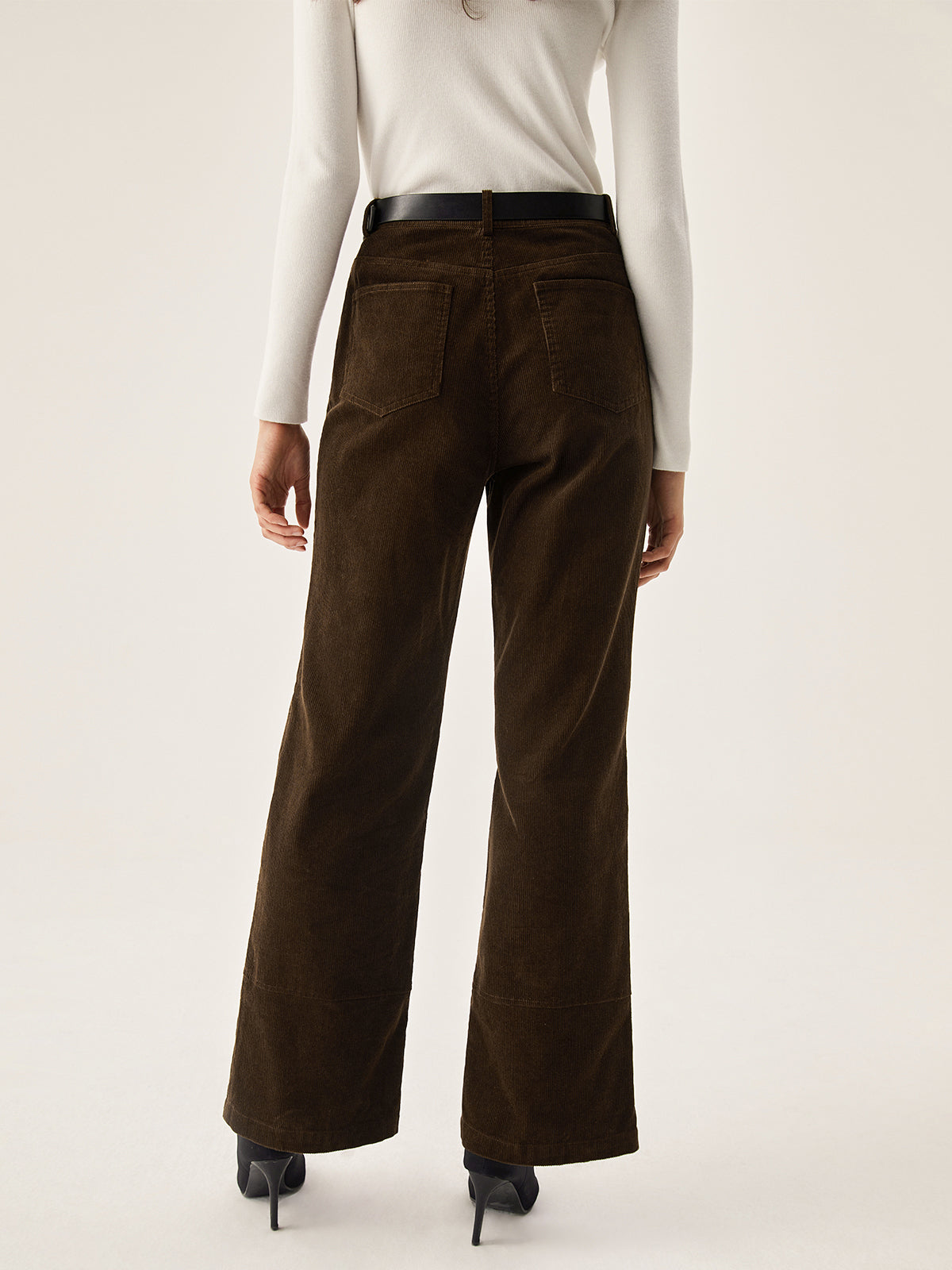 Dark brown LA FINE FLEUR corduroy wide leg pants with pockets, white long-sleeve top, black heels.