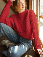 BYPINKYPARIS Limoncello Oversized Knit Sweater paired with light blue jeans and white sneakers.