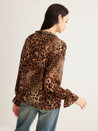 Leopard print ruffle blouse paired with classic blue jeans from LA FINE FLEUR collection.
