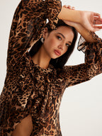 LA FINE FLEUR Leopard Print Blouse featuring ruffle detail and long sleeves.