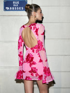 Slim-fit, backless pink mesh dress with bold red floral patterns from LA FINE FLEUR.