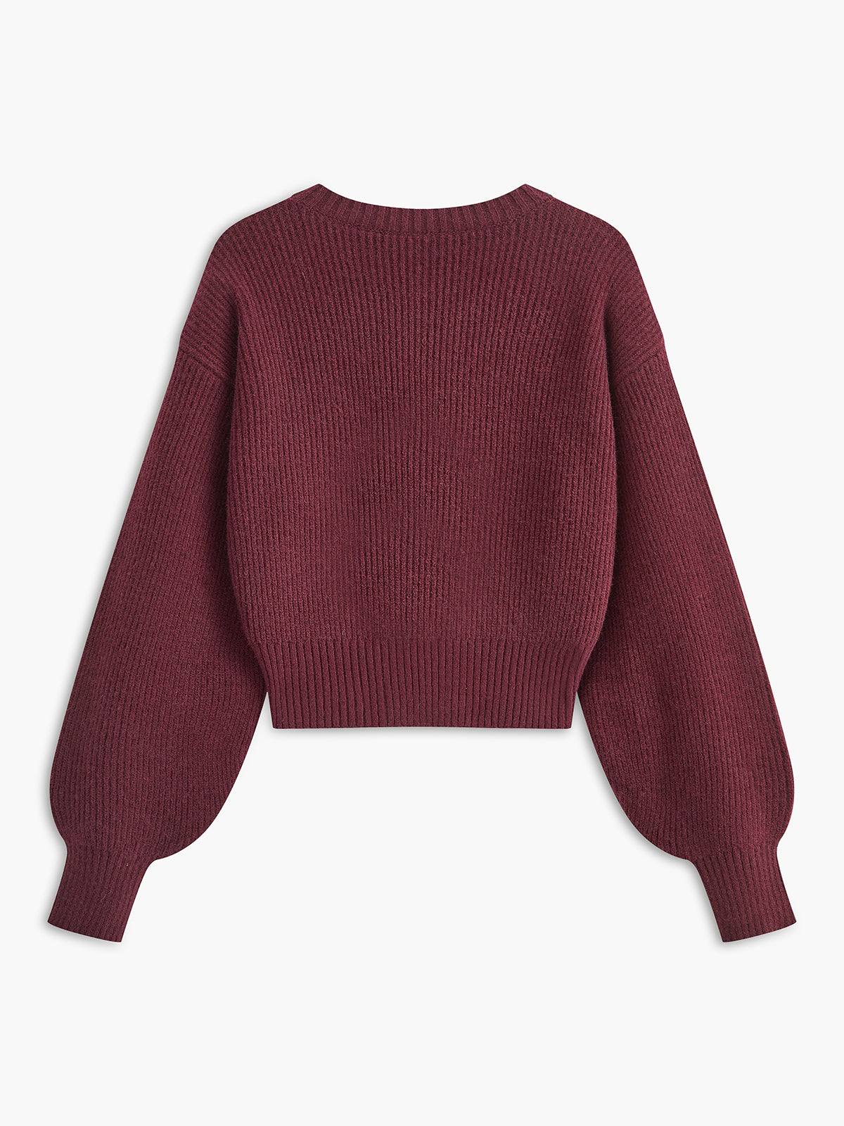 A cropped, ribbed cardigan with lace trim, long sleeves, bow ties, and crew neck.