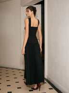 A choker neck dress with pleated front detail in a smooth, elegant fabric.