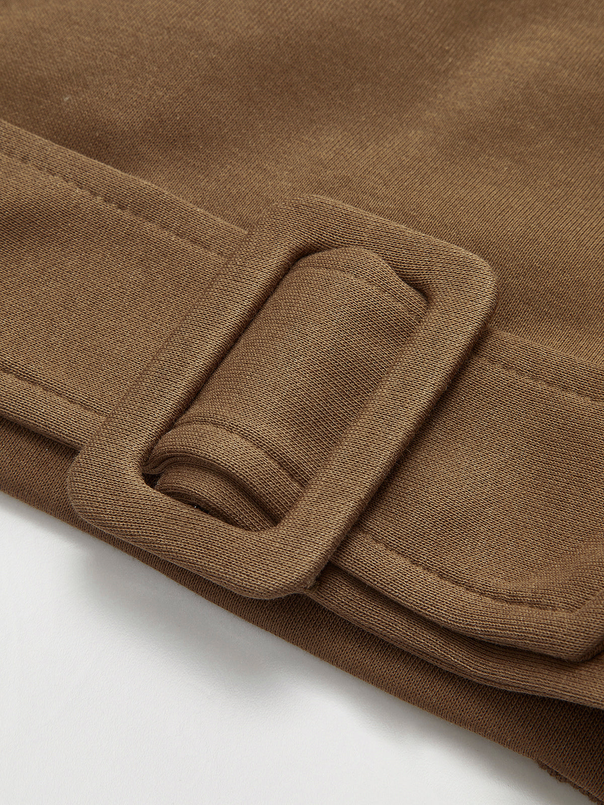 Oversized brown cinched-waist sweatshirt sweater with sewn-on belt featuring a rectangular buckle.